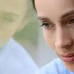 autumn tiredness fatigue person window