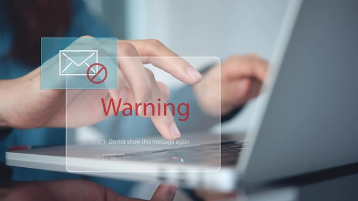 phishing email warning at computer home office