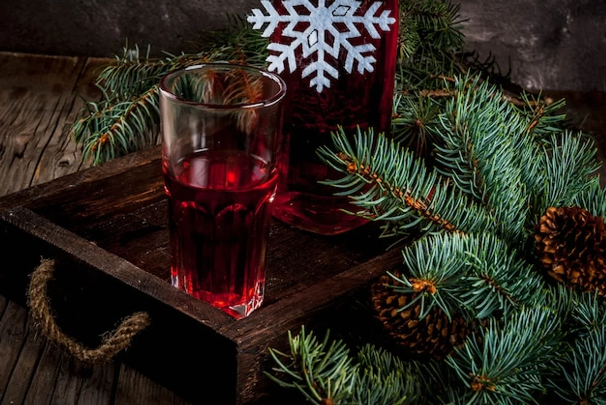 homemade autumn fruit syrup on wooden table