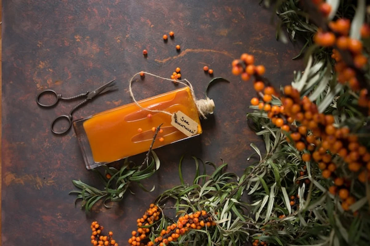 homemade fruit syrup in glass bottle autumn style