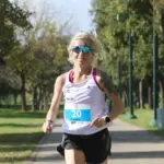 determined runner running sunrise Prague park personal record