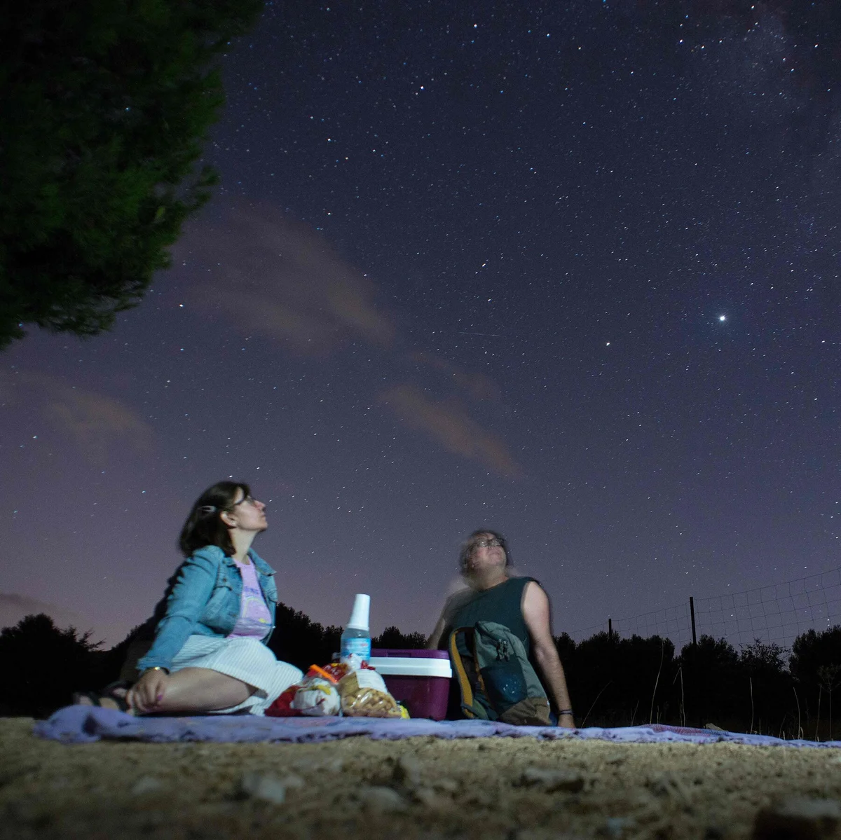 group of people watching meteor shower czech nature evening