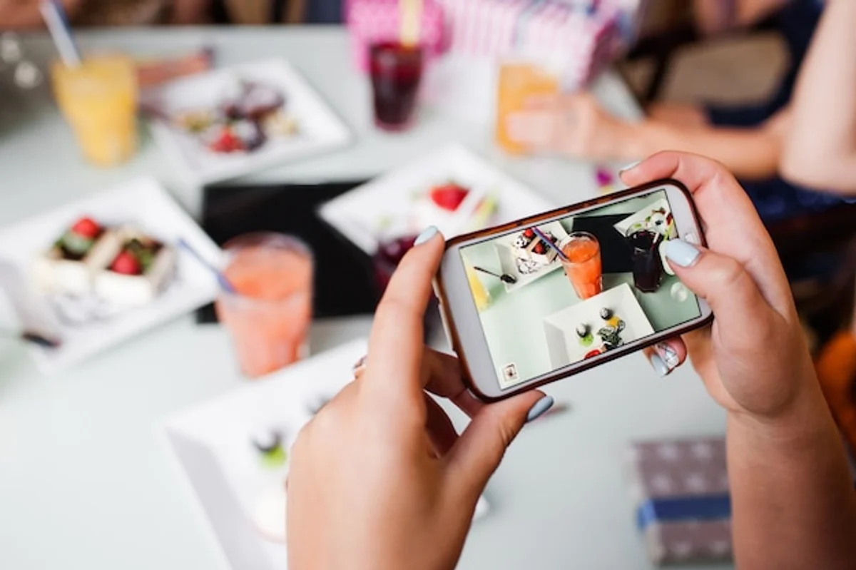 technology and social behavior, modern people with smartphones in cafe