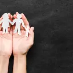 european family using laptop at home looking secure autumn