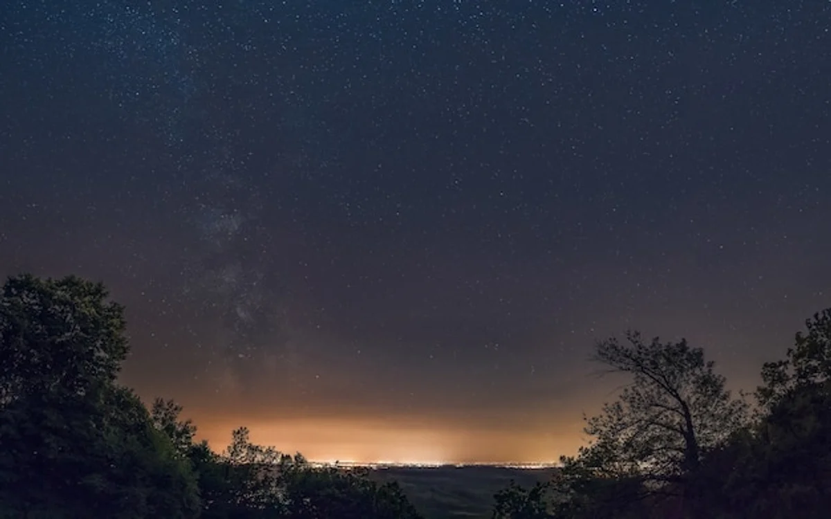milky way night sky over european mountains