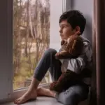 tired person autumn window rain