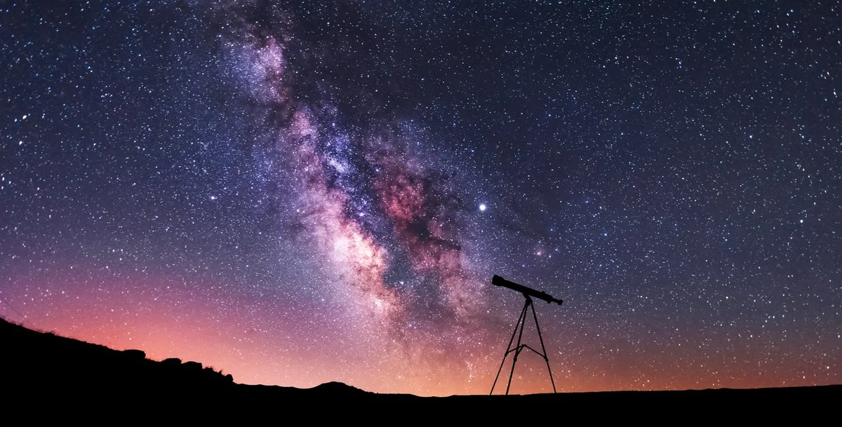 people stargazing with telescope in czech nature in autumn