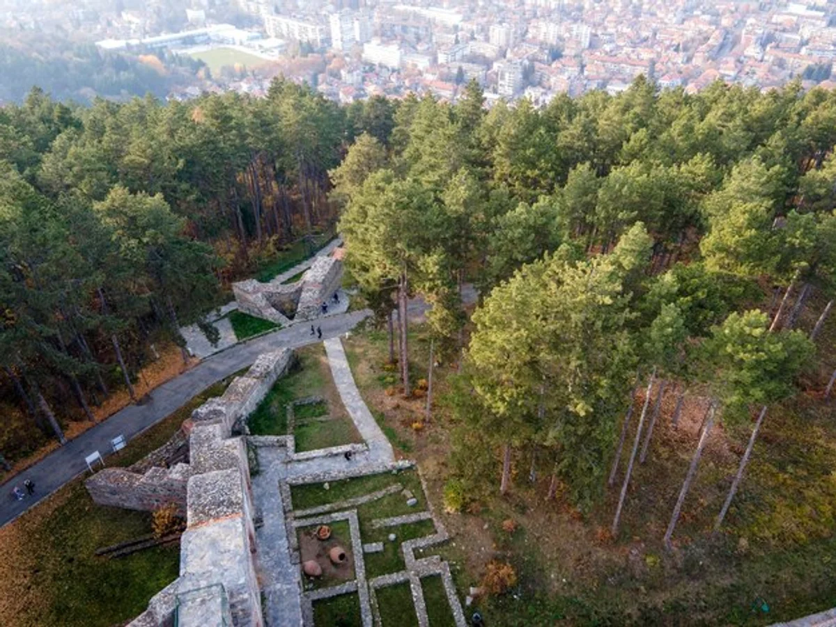 roman fort ruins in european forest aerial view