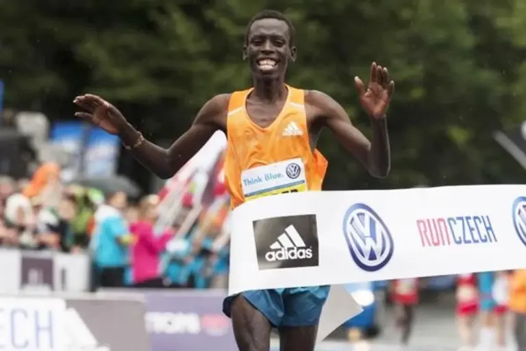 Czech marathon athlete running rain victory