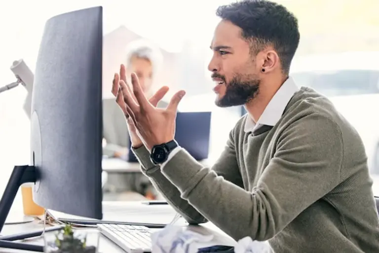 man frustrated by email mistake office