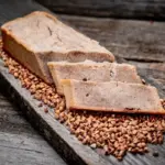 fresh gluten free buckwheat bread on rustic wooden table
