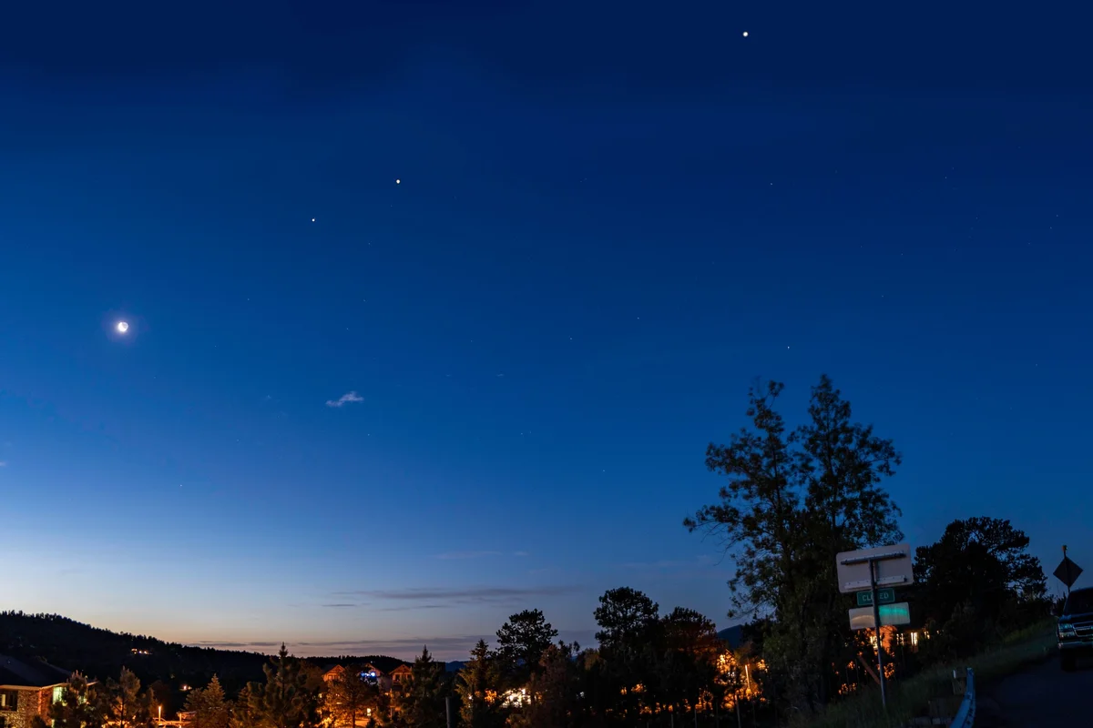 planets alignment over Czech countryside at dawn